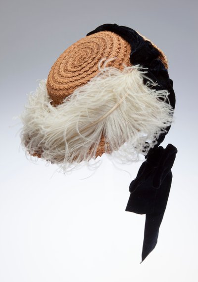 Straw Bonnet with Black Velvet Ribbon and White Ostrich Plume Across Brim. Made in Austria and Worn by Sophie Tuholske by Unknown